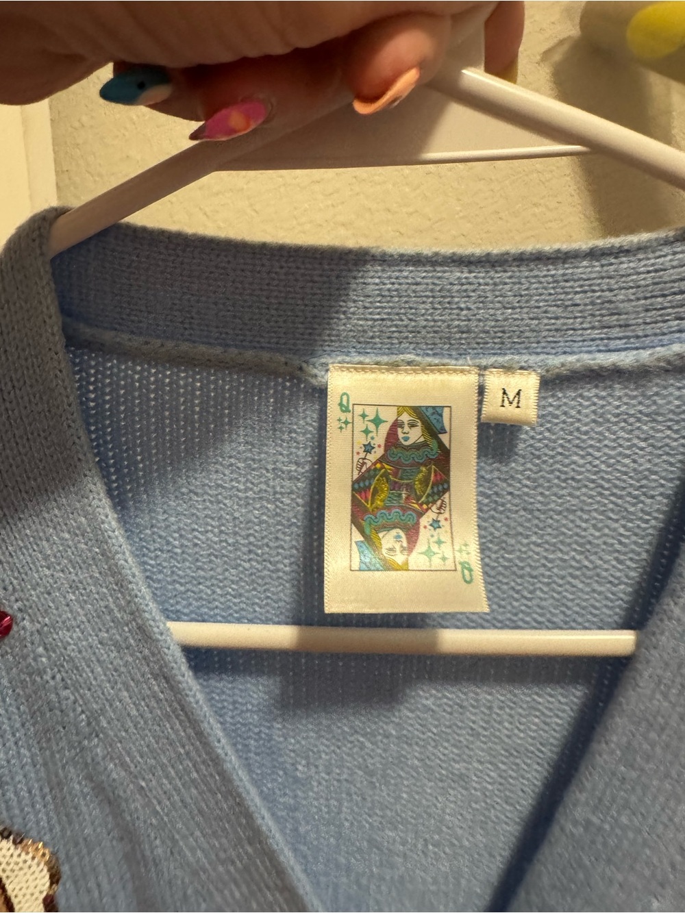 Light Blue Cardigan Sweater with Colorful Nutcracker Sequin Design - Picture 8 of 9